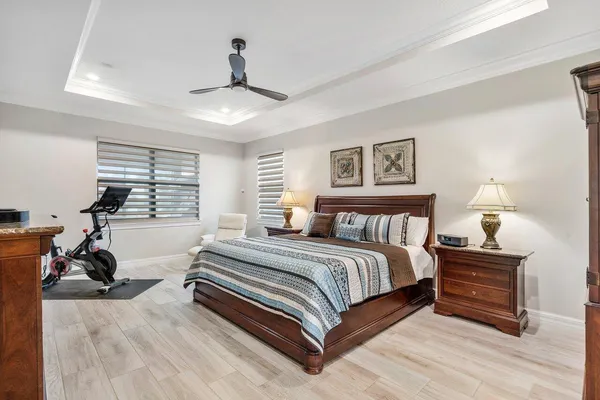 a spacious bathroom with a granite countertop tub sink and mirror