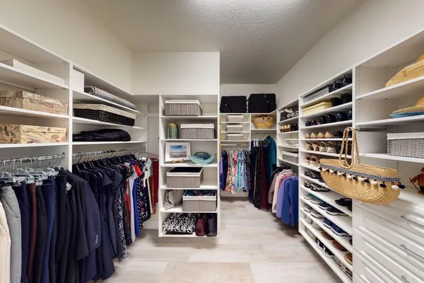 a bathroom with a granite countertop bathtub shower sink and toilet