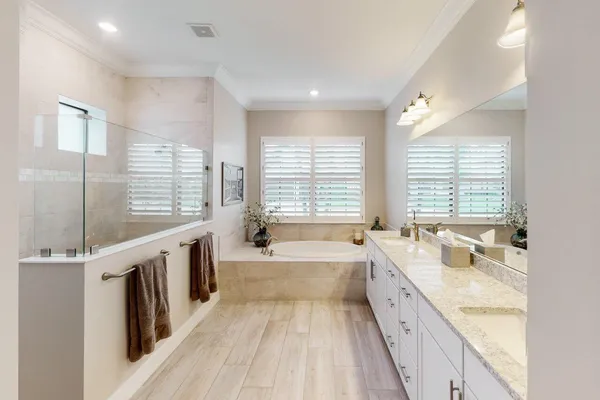 a bathroom with a double vanity sink mirror and double