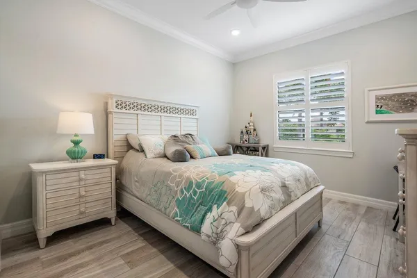 a view of a patio with couches table and chairs and potted plants