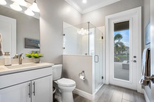 a view of a house with backyard sitting area and garden