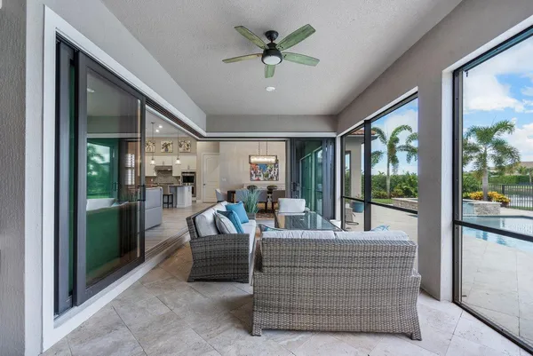 a view of a swimming pool with a lounge chairs