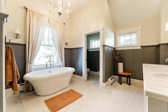 a spacious bathroom with a bathtub and shower