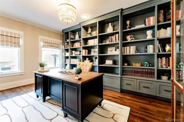 a room with a bookshelf and a window