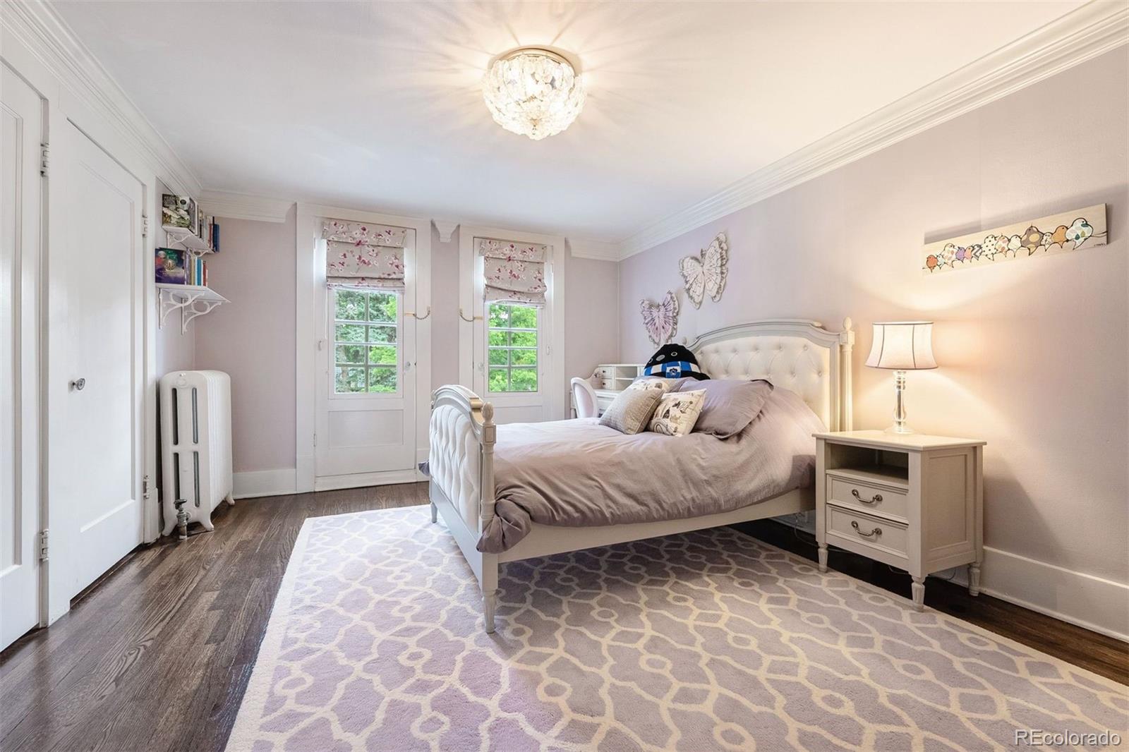 4535 Montview Boulevard Denver, CO 80207 - Photo 19 of 27 a bedroom with a bed and a window