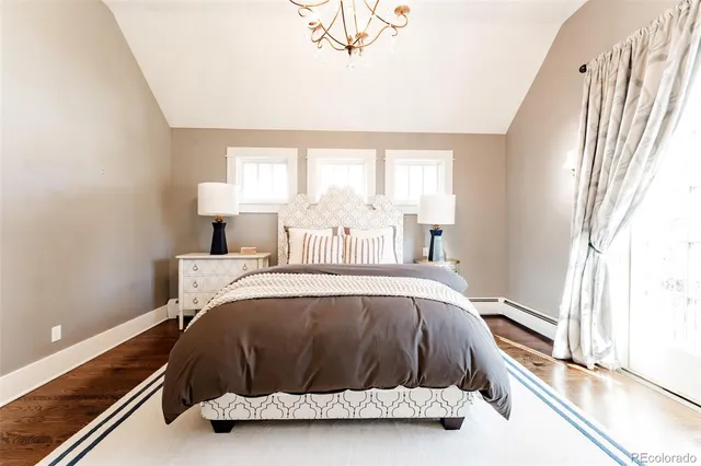 a room with a bed and window