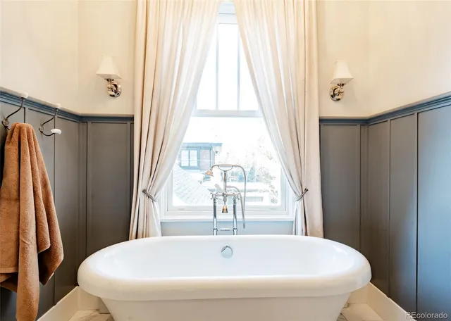 a bathroom with a bathtub and shower