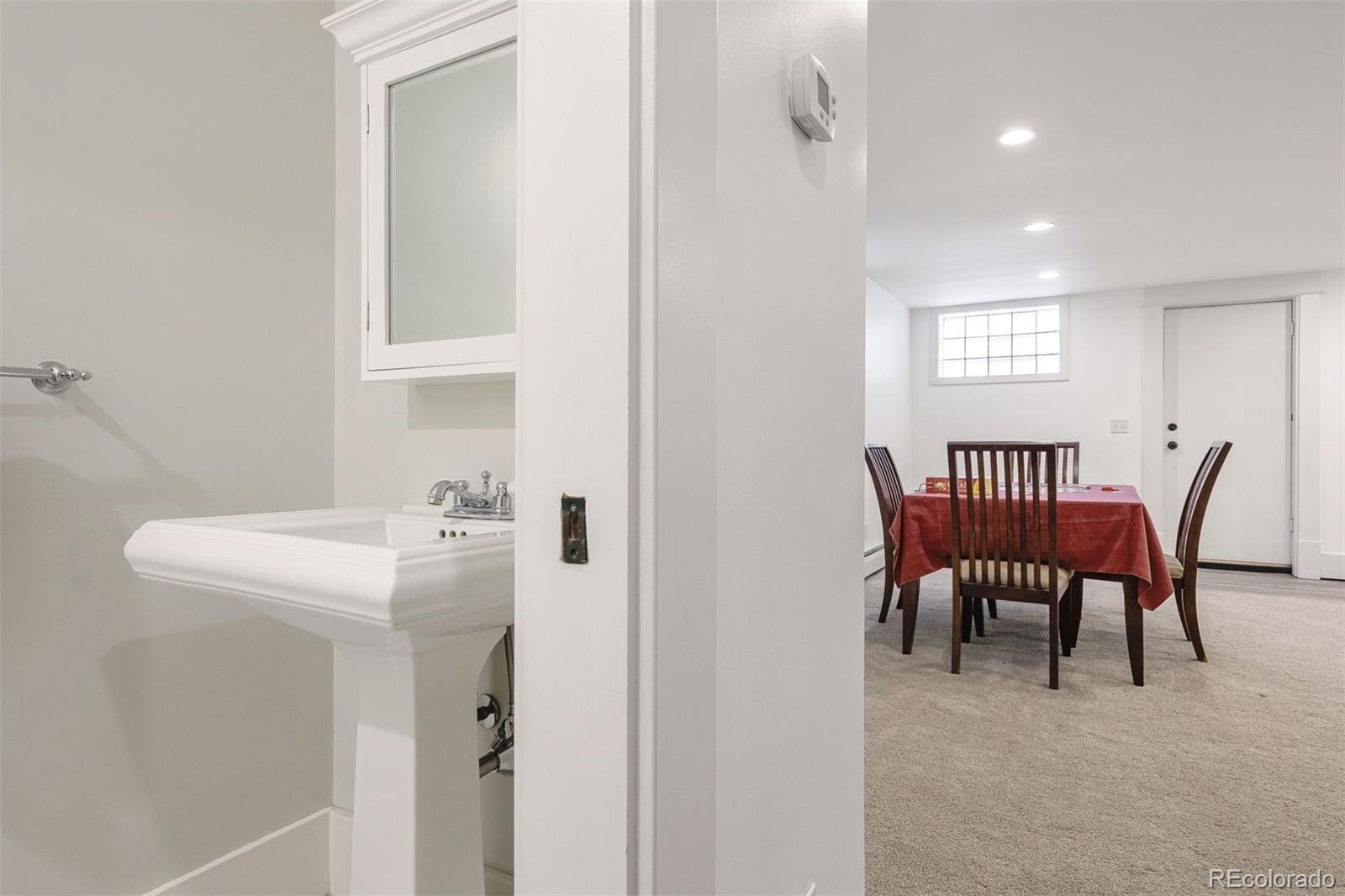 4535 Montview Boulevard Denver, CO 80207 - Photo 23 of 27 a view of a room that has a table and chairs in it
