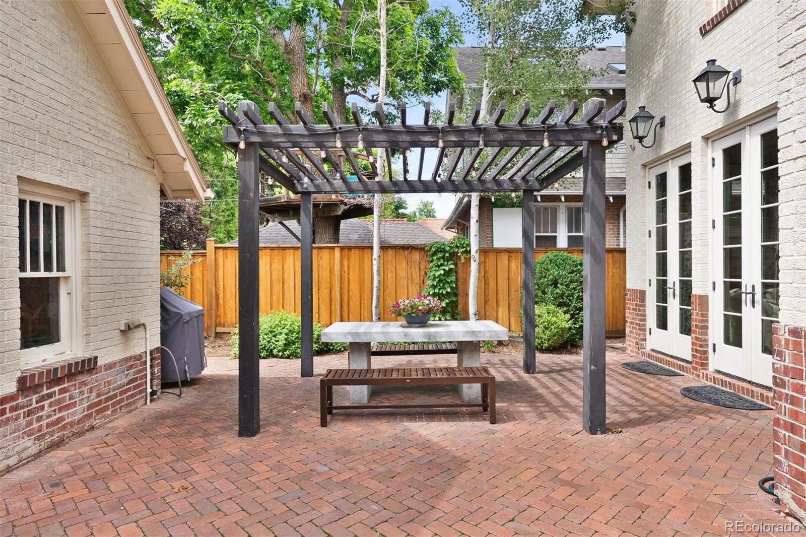 4535 Montview Boulevard Denver, CO 80207 - Photo 25 of 27 a building outdoor space with patio furniture and potted plants