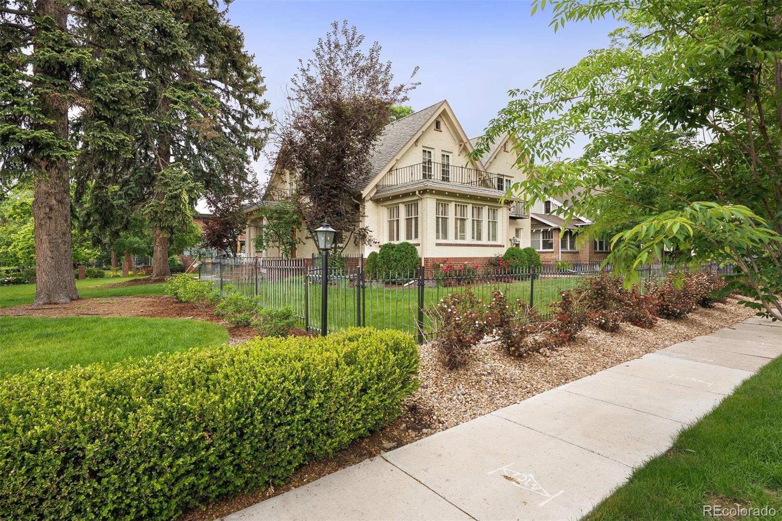4535 Montview Boulevard Denver, CO 80207 - Photo 27 of 27 a front view of a house with a yard