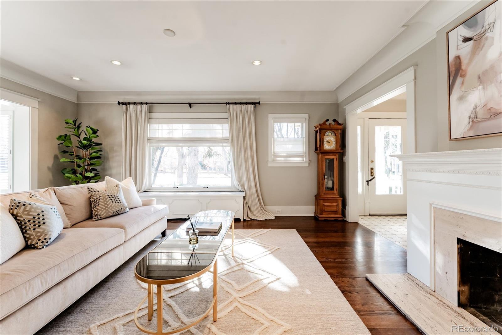 4535 Montview Boulevard Denver, CO 80207 - Photo 5 of 24 a living room with furniture and a fireplace