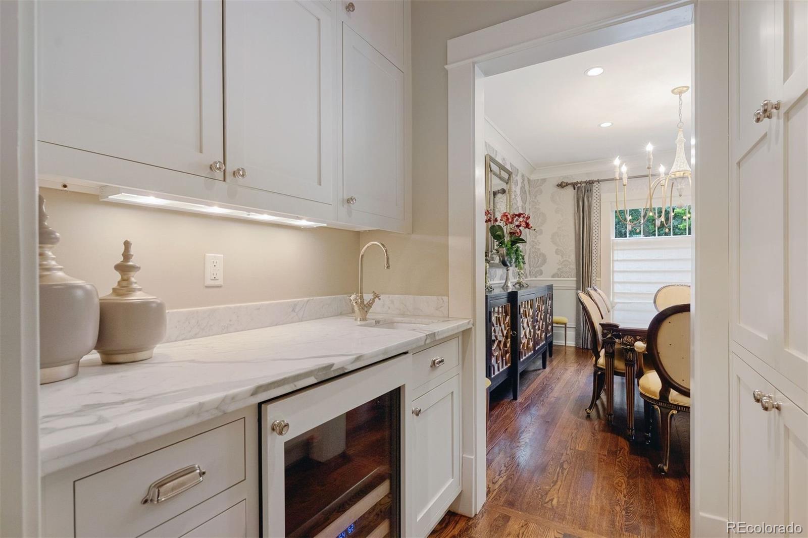 4535 Montview Boulevard Denver, CO 80207 - Photo 5 of 27 a kitchen with a sink a stove and cabinets