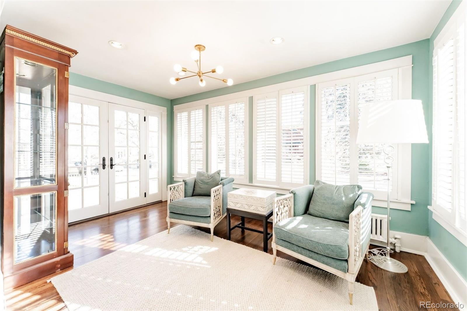 4535 Montview Boulevard Denver, CO 80207 - Photo 6 of 27 a living room with furniture and a large window