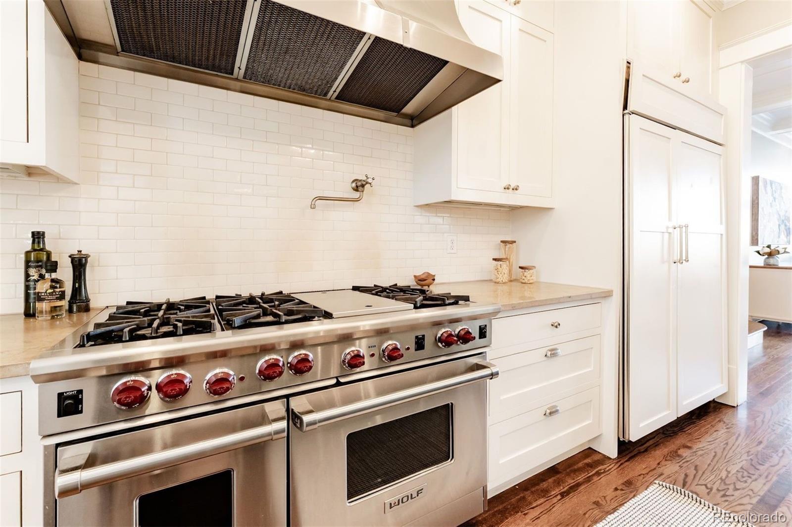 4535 Montview Boulevard Denver, CO 80207 - Photo 8 of 27 a stove top oven sitting inside of a kitchen
