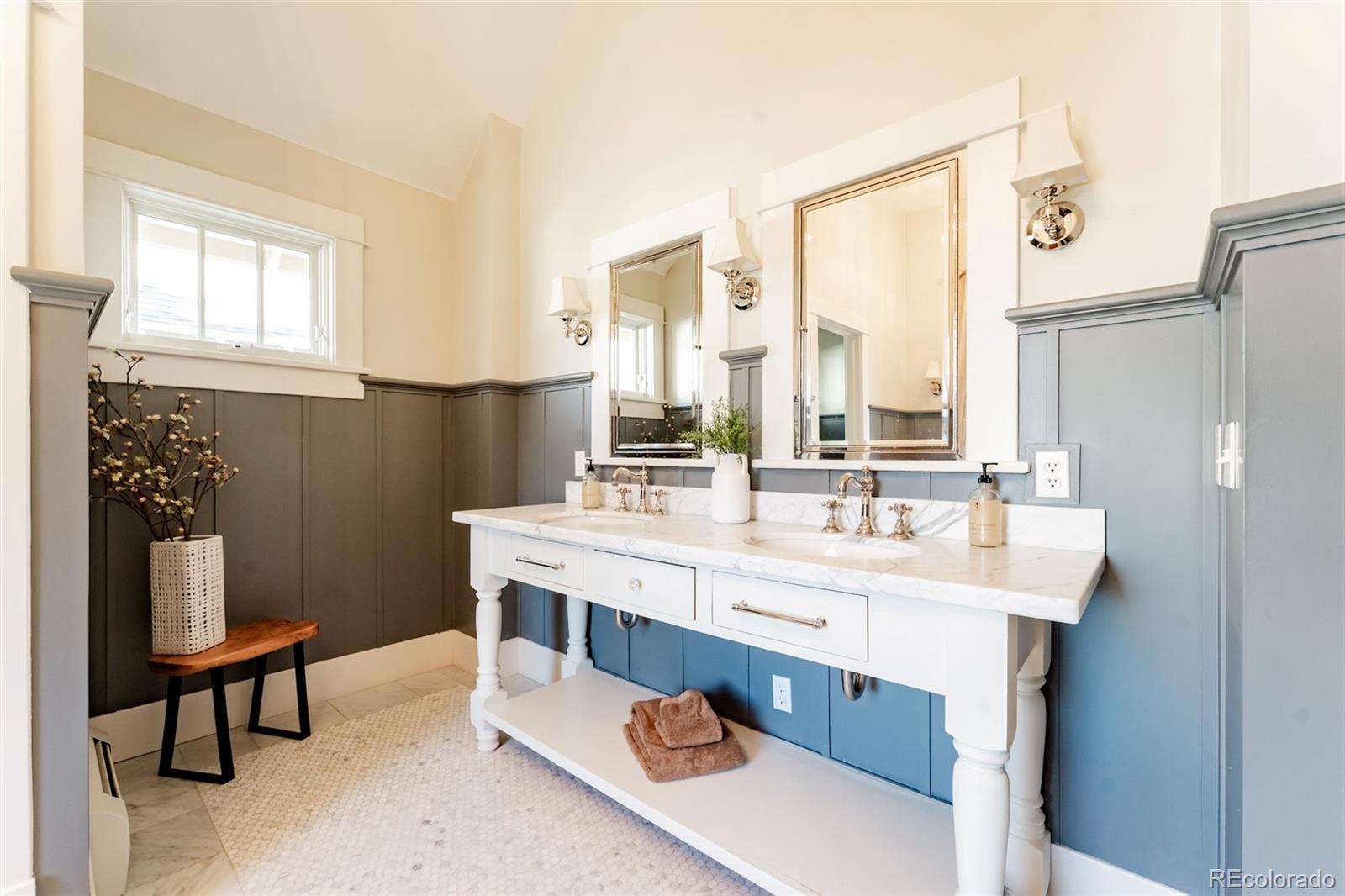 4535 Montview Boulevard Denver, CO 80207 - Photo 8 of 24 a bathroom with a double vanity sink a mirror and a shower