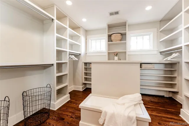 a bedroom with a bed and cabinets