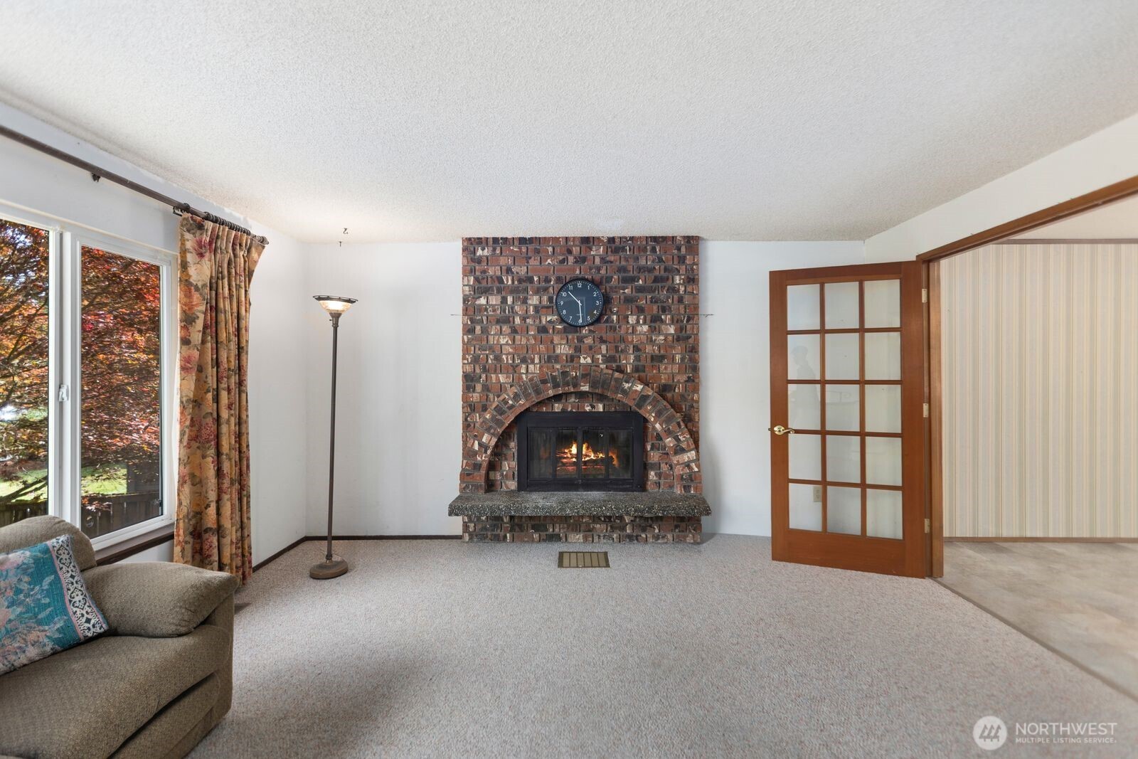 21627 9th Place West Bothell, WA 98021 - Photo 7 of 40 a living room with furniture a window and a fireplace