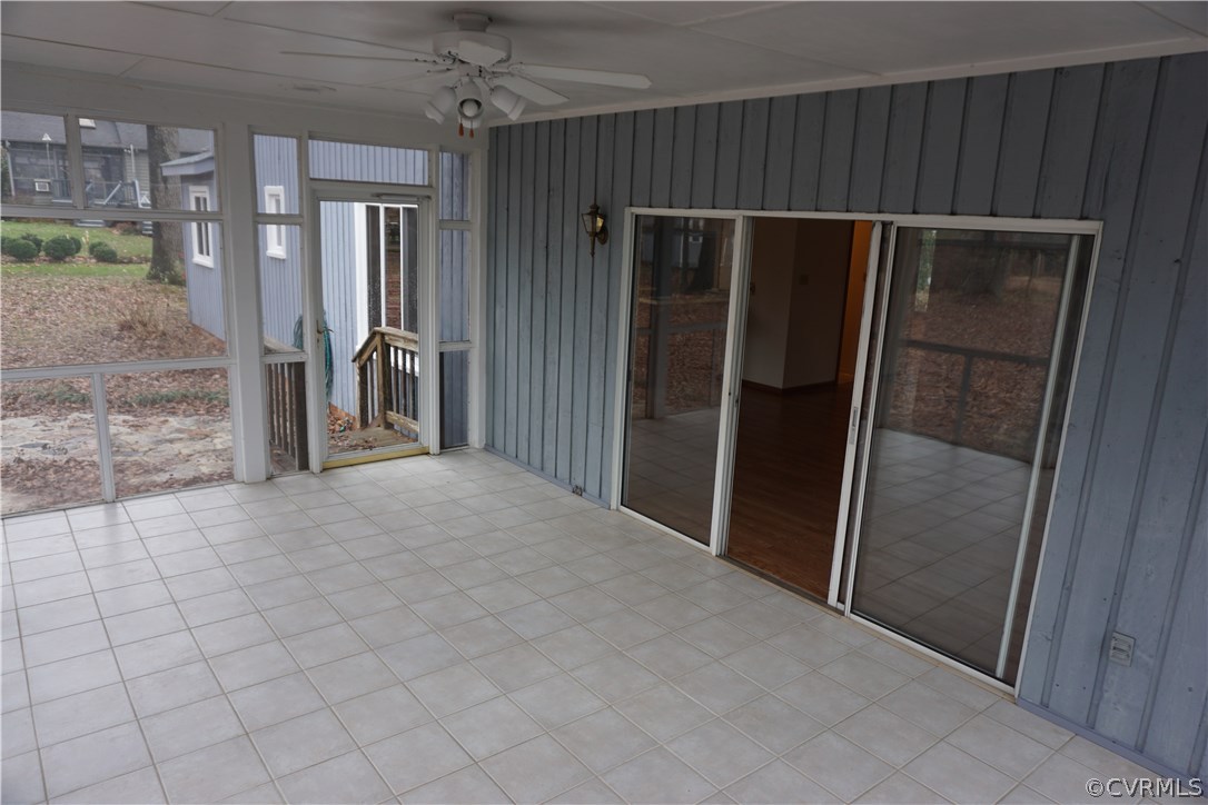 613 Rebel Ridge Road Colonial Heights, VA 23834 - Photo 23 of 40 Sun room exits out onto a rock patio.