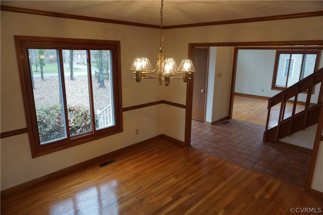 613 Rebel Ridge Road Colonial Heights, VA 23834 - Photo 9 of 40 Formal dining room hardwood floor and lots of natu