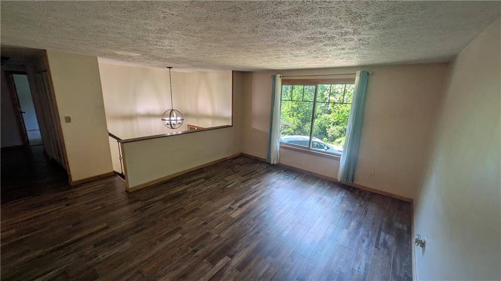 201 Colleen Street Butler, PA 16001 - Photo 19 of 33 a view of an empty room with a window and wooden floor