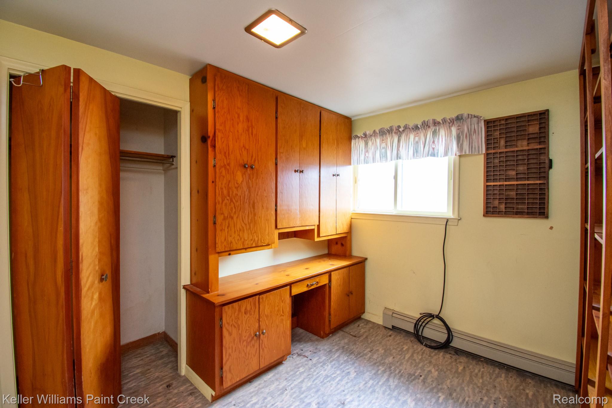 6533 River Road Marine City, MI 48039 - Photo 11 of 17 Unfurnished office featuring built in study area and a baseboard heating unit
