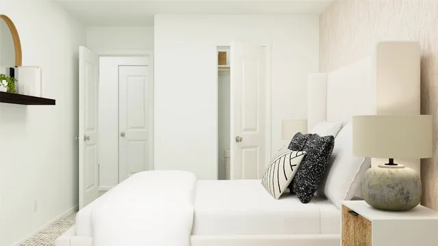 a bedroom with a bed and a mirror