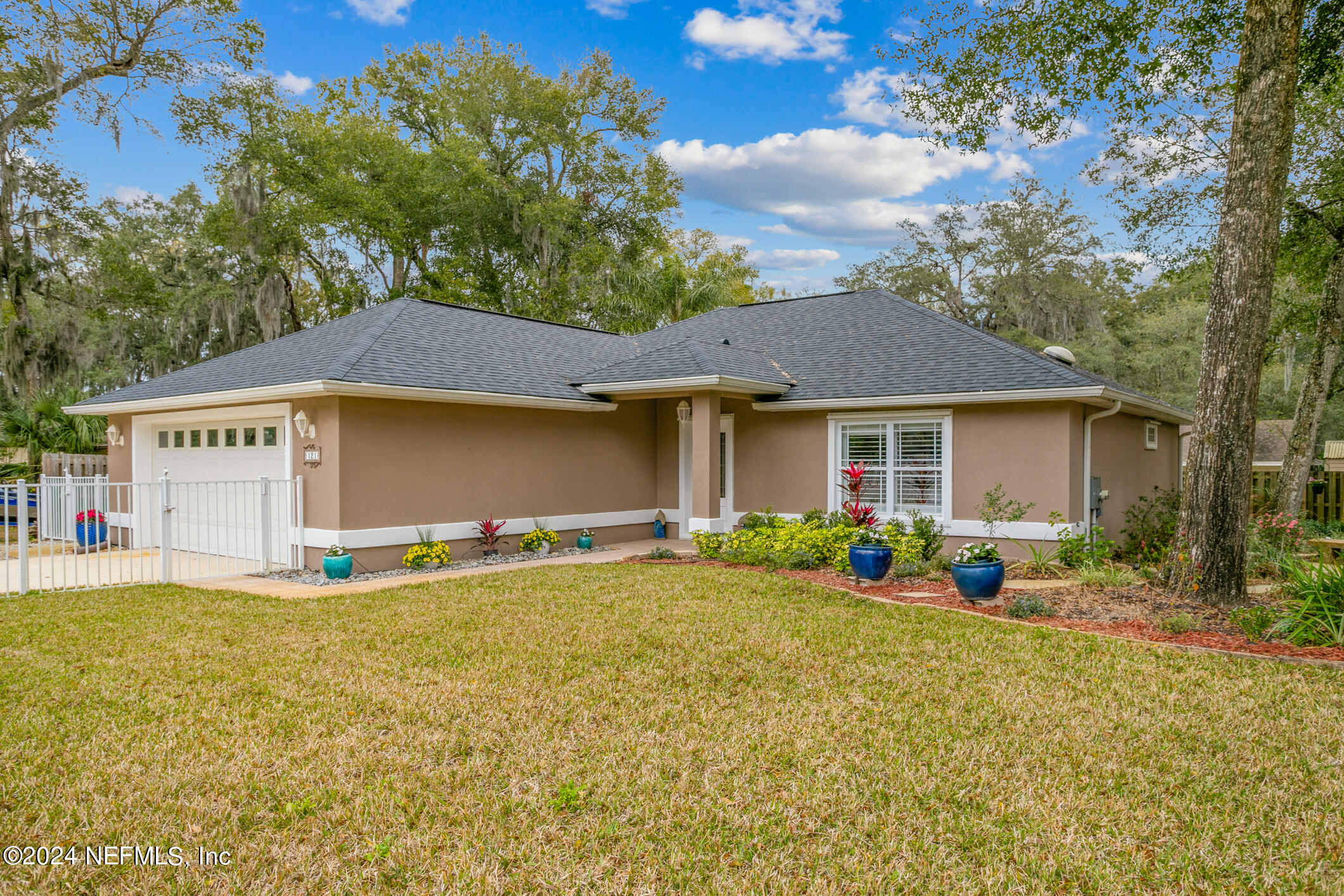 121 Cypress Road St. Augustine, FL 32086 - Photo 1 of 60 a view of a house with a yard and sitting area