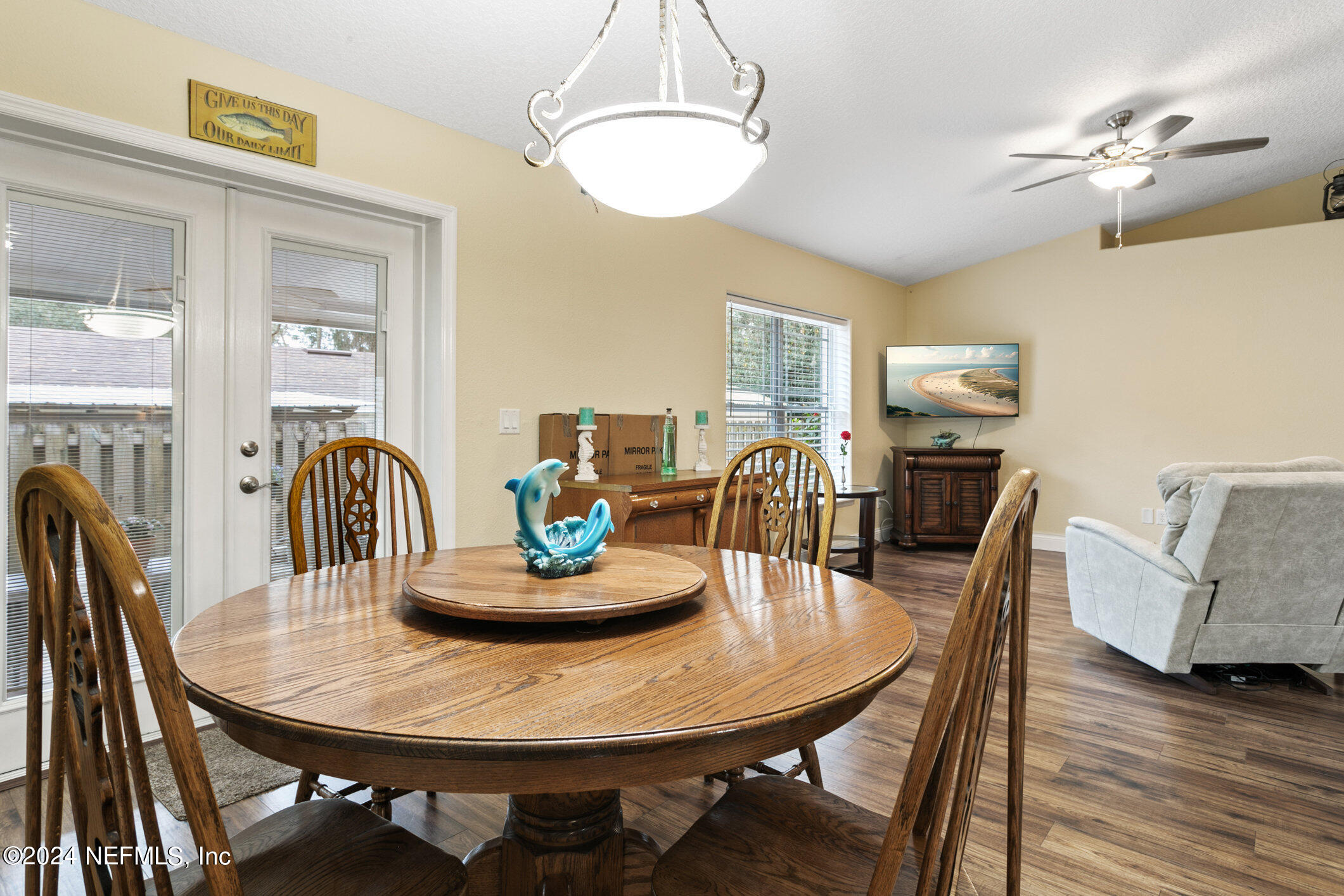 121 Cypress Road St. Augustine, FL 32086 - Photo 17 of 60 a dining room with furniture a chandelier and wooden floor