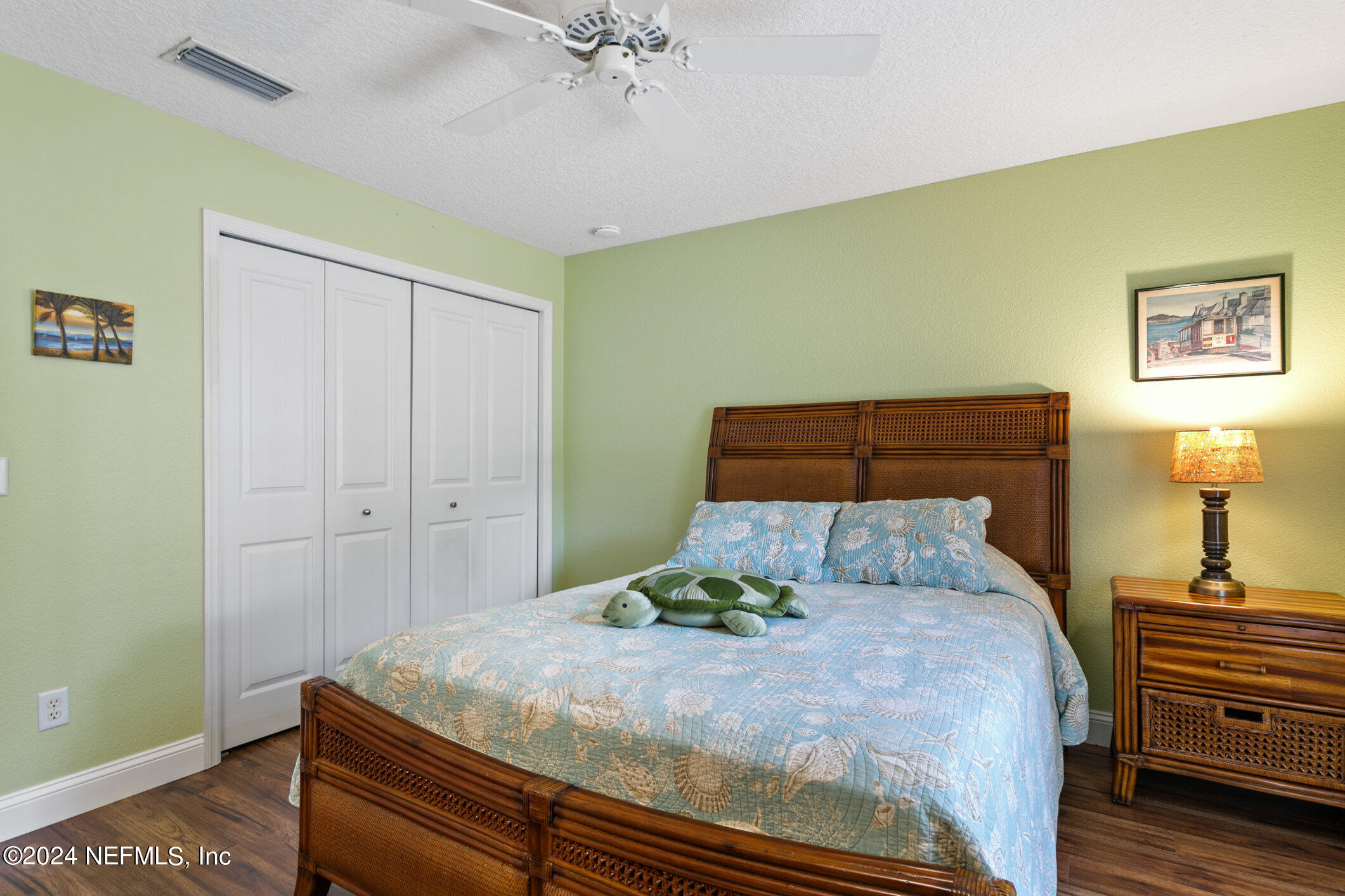 121 Cypress Road St. Augustine, FL 32086 - Photo 24 of 60 a bedroom with a bed and a chandelier