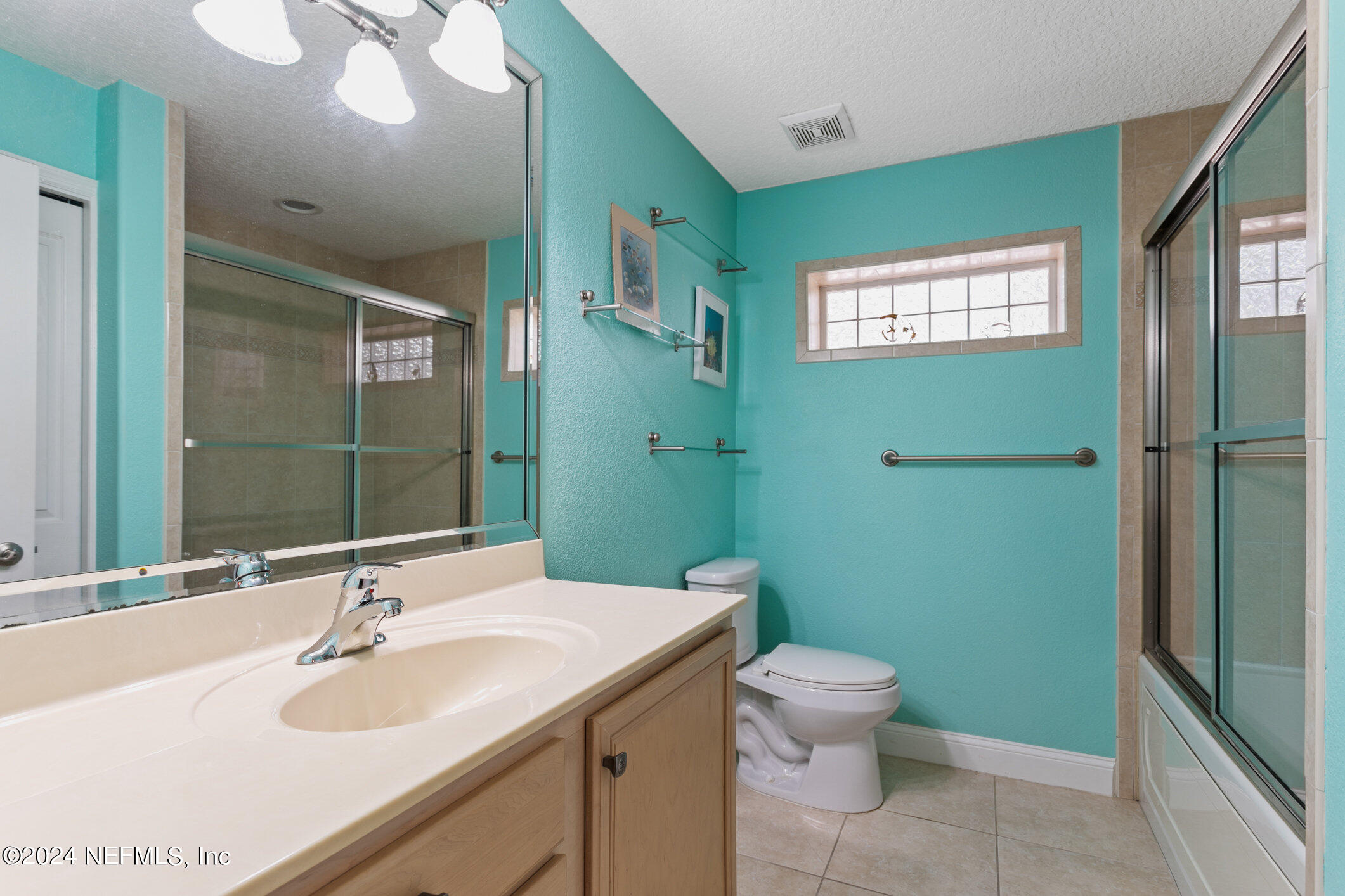 121 Cypress Road St. Augustine, FL 32086 - Photo 25 of 60 a bathroom with a sink toilet and shower