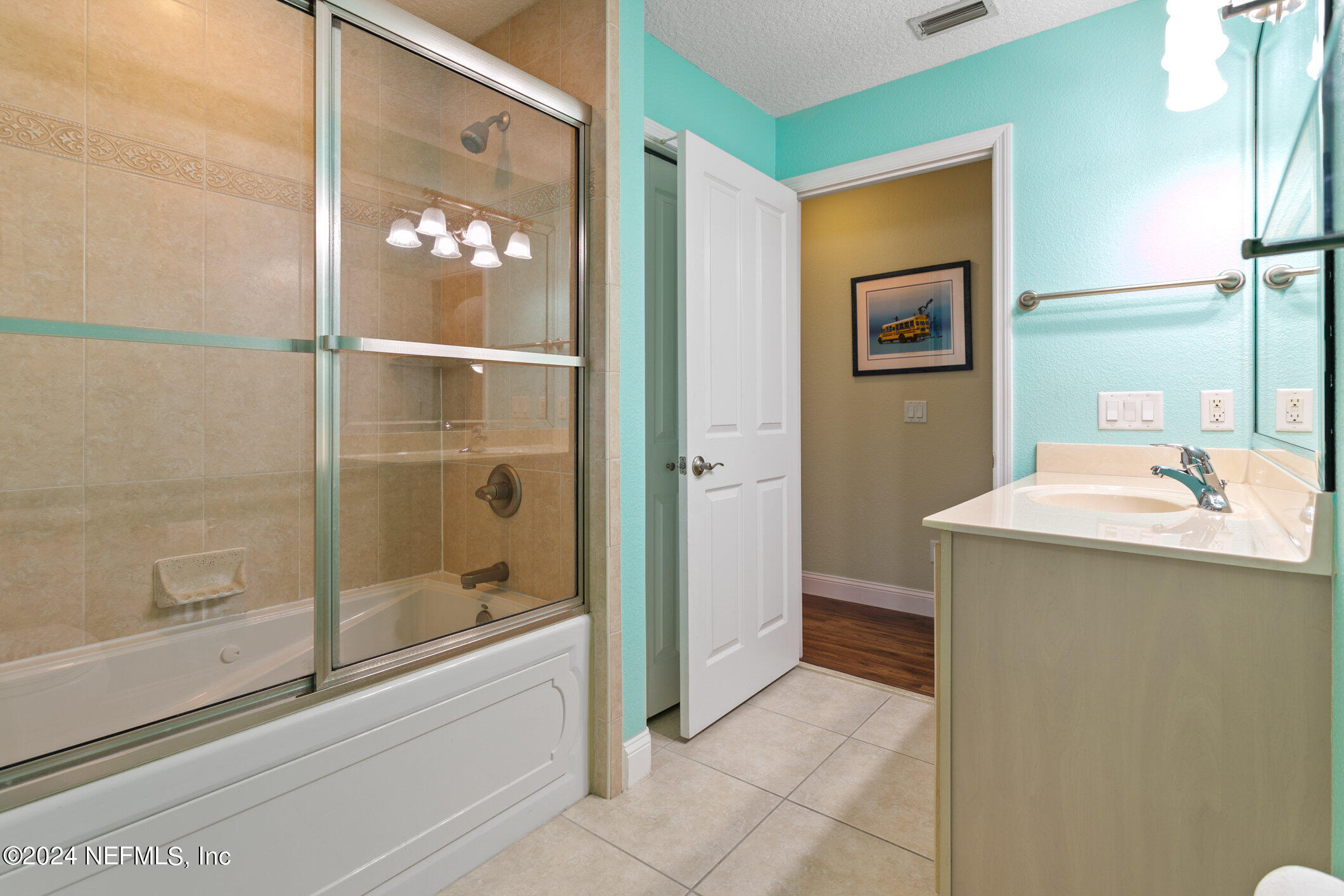 121 Cypress Road St. Augustine, FL 32086 - Photo 26 of 60 a bathroom with a granite countertop sink mirror and shower