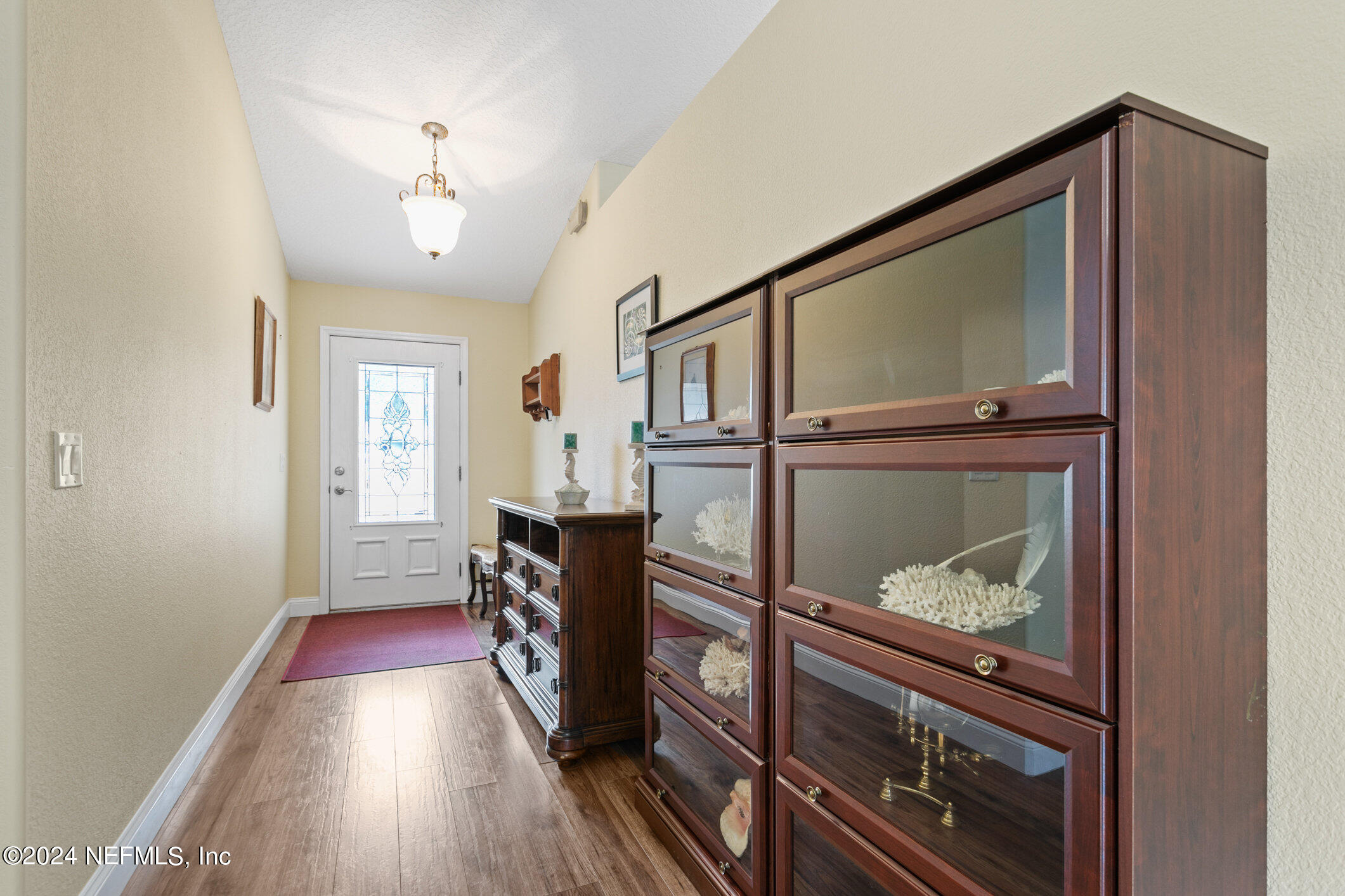 121 Cypress Road St. Augustine, FL 32086 - Photo 7 of 60 a view of a livingroom with wooden floor and furniture