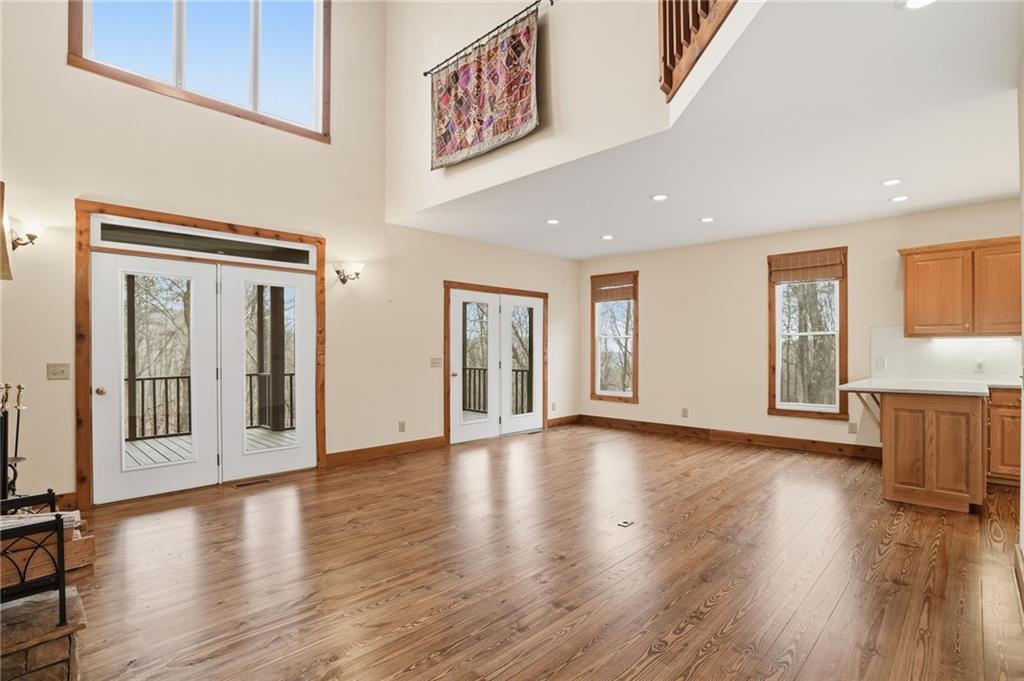 35 Red Oak Point Big Canoe, GA 30143 - Photo 12 of 62 a view of an empty room with wooden floor and a window