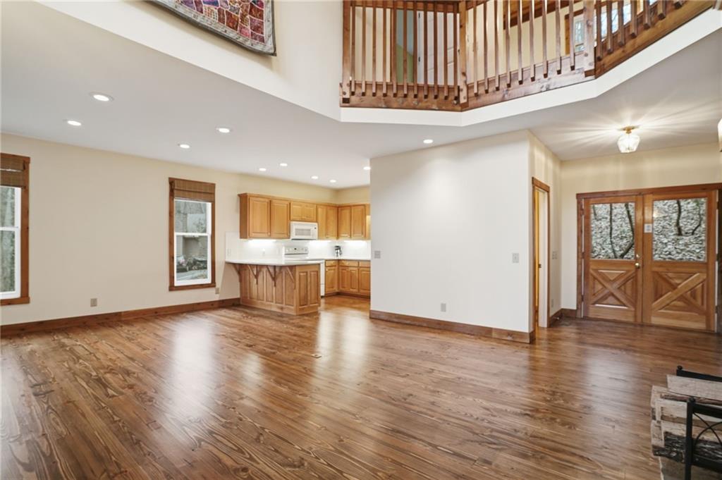 35 Red Oak Point Big Canoe, GA 30143 - Photo 13 of 62 a view of an empty room with wooden floor and a window