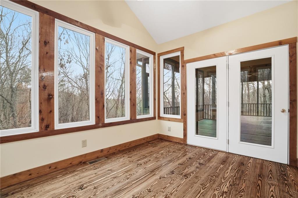 35 Red Oak Point Big Canoe, GA 30143 - Photo 24 of 62 a view of an empty room with a window and wooden floor