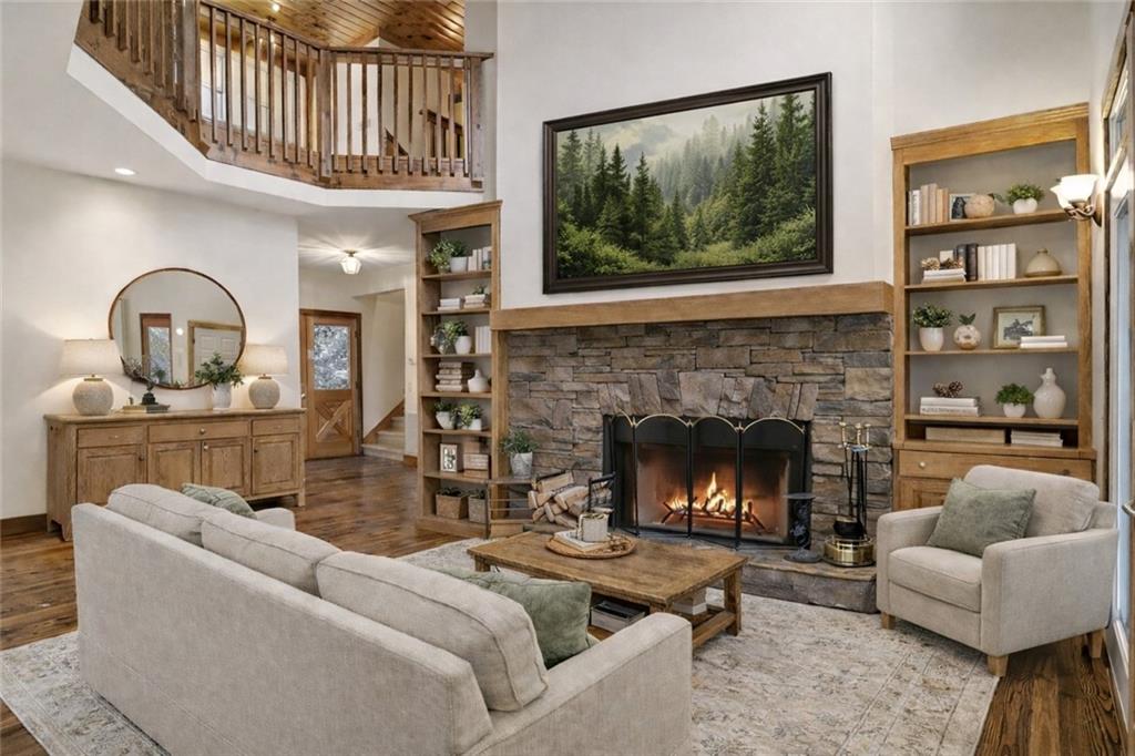 35 Red Oak Point Big Canoe, GA 30143 - Photo 9 of 62 a living room with furniture a window and a fireplace