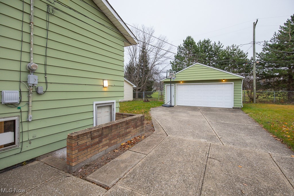 4357 Valleyside Road Cleveland, OH 44135 - Photo 24 of 26 View of property exterior featuring an outdoor structure and a garage