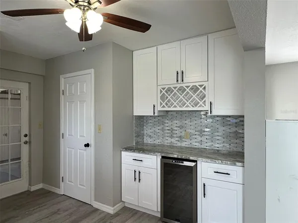a kitchen with stainless steel appliances granite countertop a stove and a granite counter tops