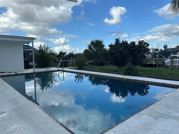 a view of swimming pool with a yard