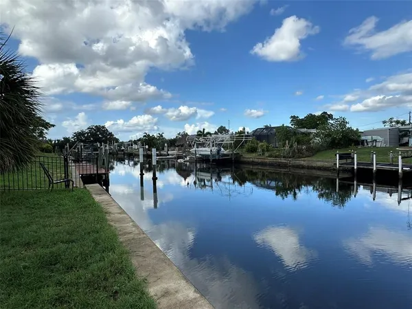 a view of a lake with a yard