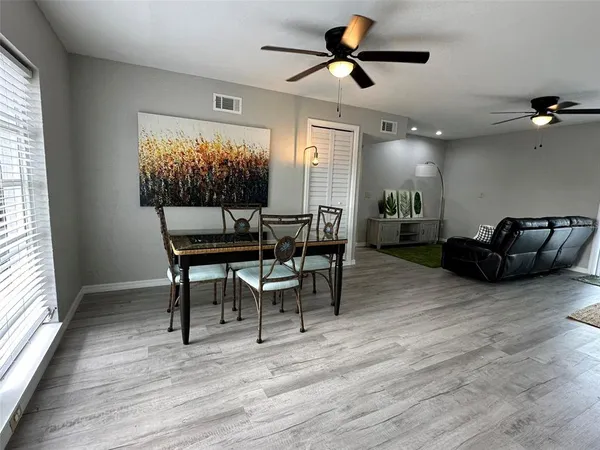a view of a livingroom with furniture and a window