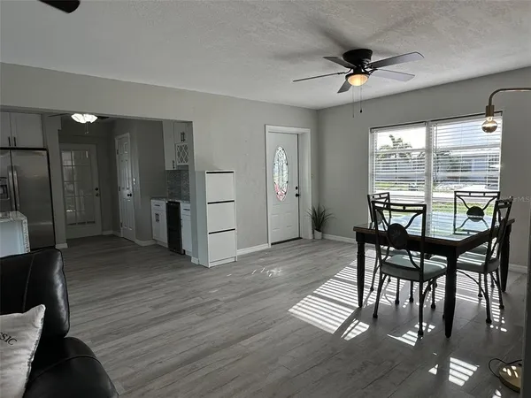 a view of a dining room with furniture window and wooden floor