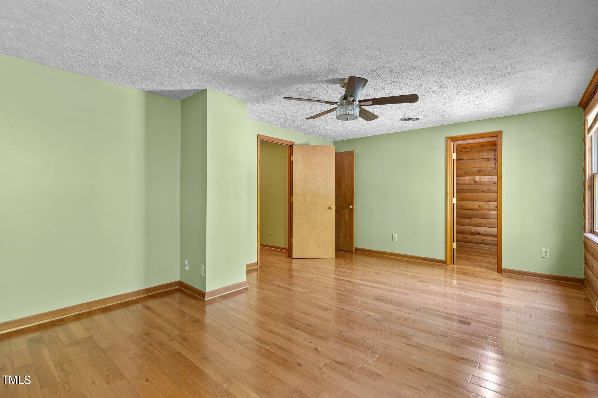 1819 Chambers Loop Road Timberlake, NC 27583 - Photo 18 of 41 wooden floor in an empty room with a window