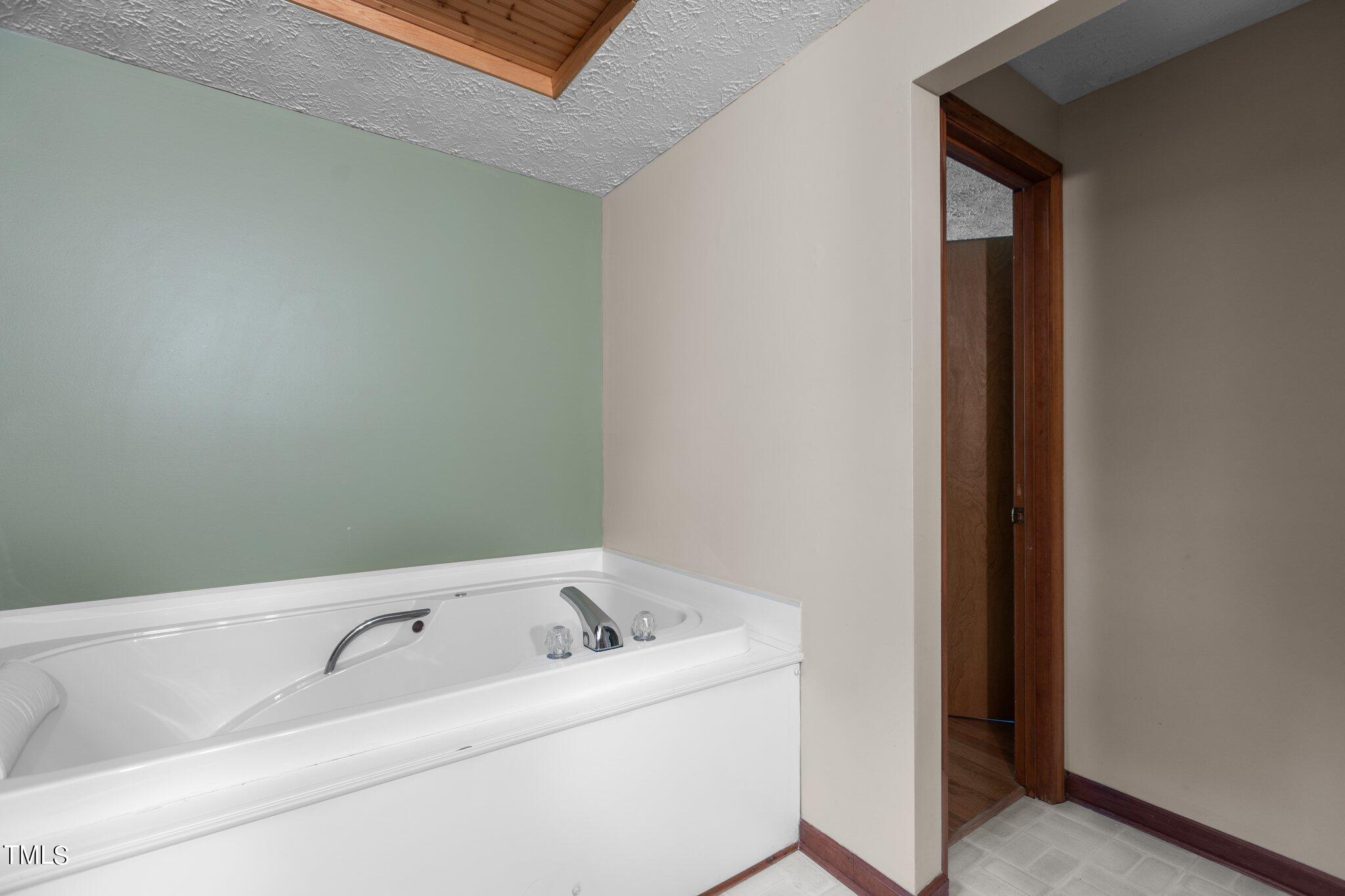 1819 Chambers Loop Road Timberlake, NC 27583 - Photo 21 of 41 a bathroom with a bathtub and sink