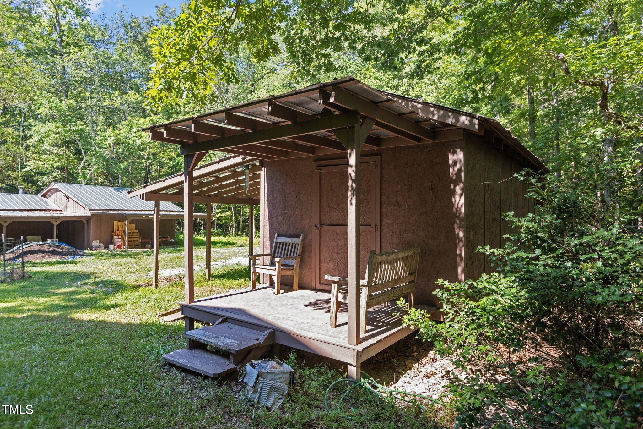 1819 Chambers Loop Road Timberlake, NC 27583 - Photo 26 of 41 a view of house with a yard outdoor seating and green space