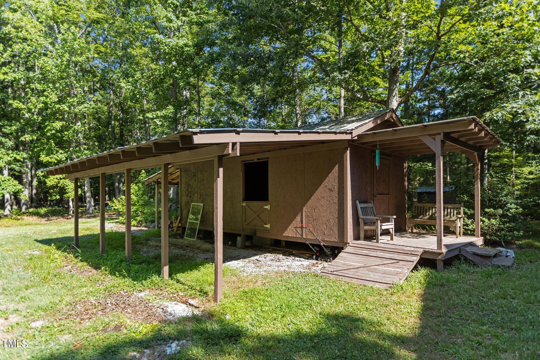 1819 Chambers Loop Road Timberlake, NC 27583 - Photo 30 of 41 a view of a house with backyard porch and sitting area
