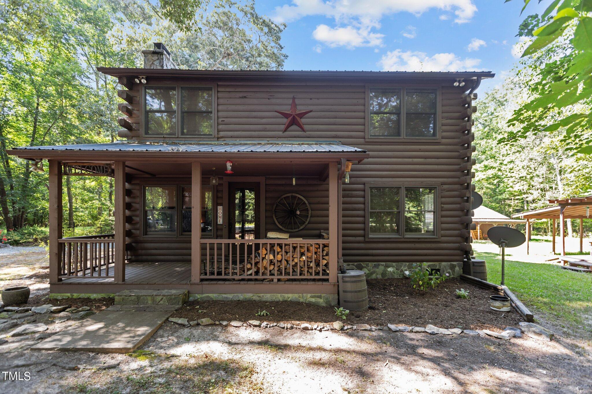 1819 Chambers Loop Road Timberlake, NC 27583 - Photo 3 of 41 a front view of a house with a porch