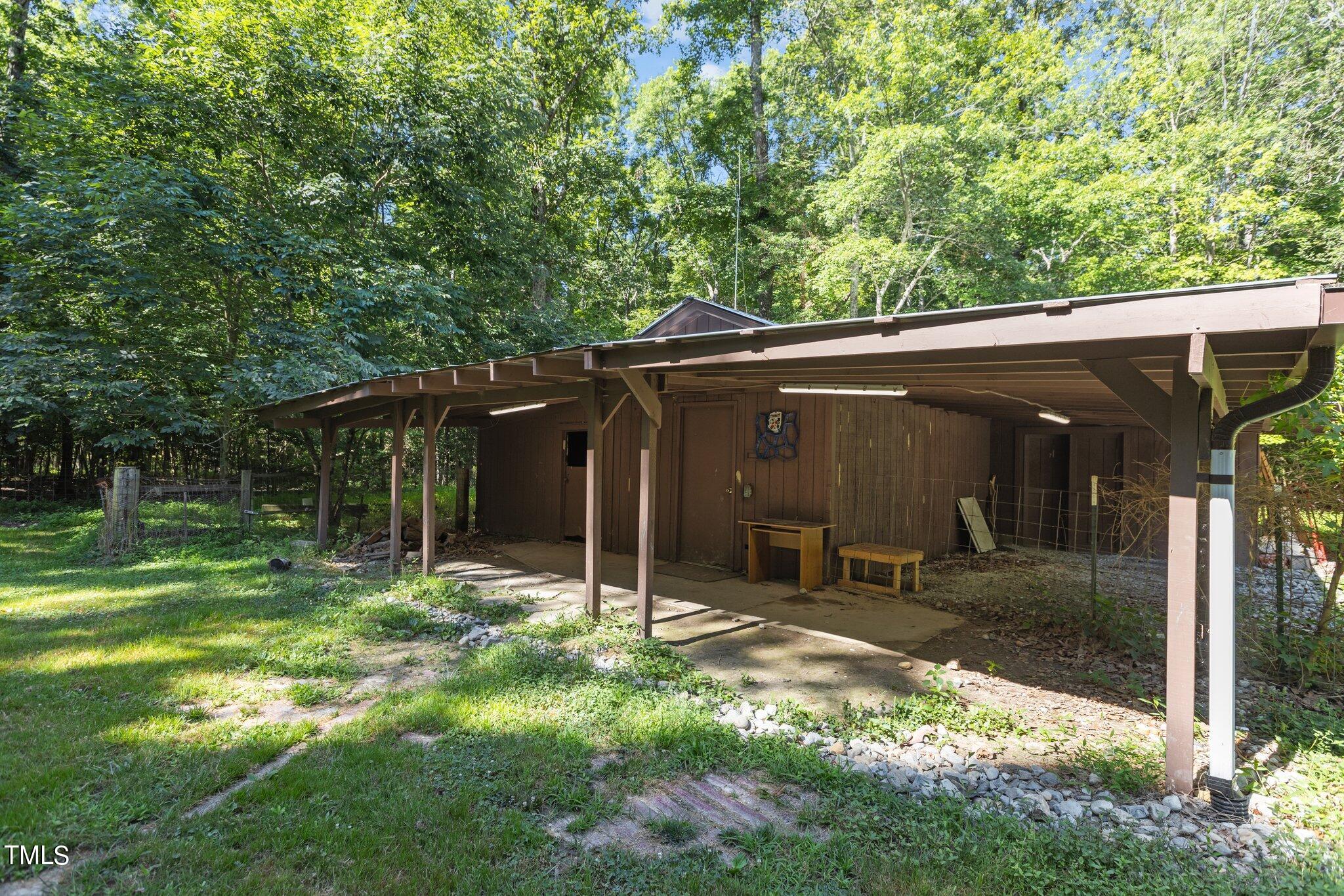 1819 Chambers Loop Road Timberlake, NC 27583 - Photo 35 of 41 a backyard of a house with table and chairs