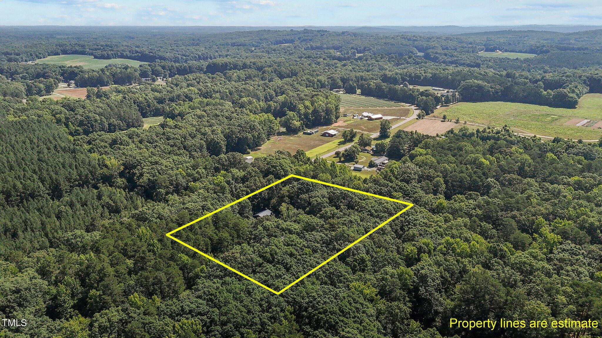 1819 Chambers Loop Road Timberlake, NC 27583 - Photo 39 of 41 an aerial view of a house
