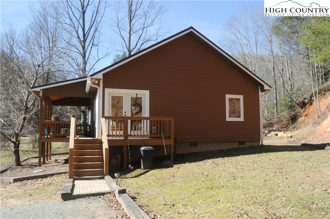 4935 Wildcat Road Deep Gap, NC 28618 - Photo 1 of 33 a front view of a house with a yard
